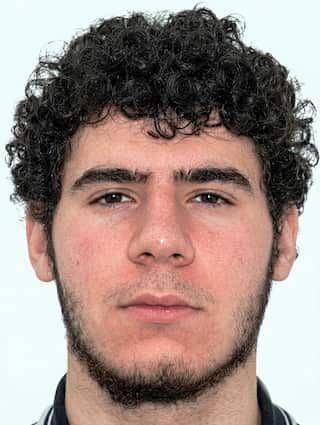 A mugshot of a man who is looking at the camera