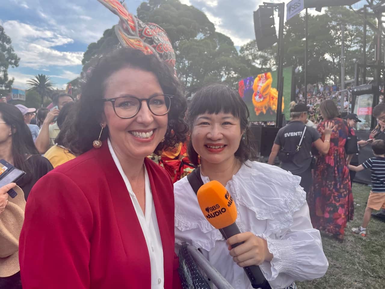 Community member giving out red packet.jpeg