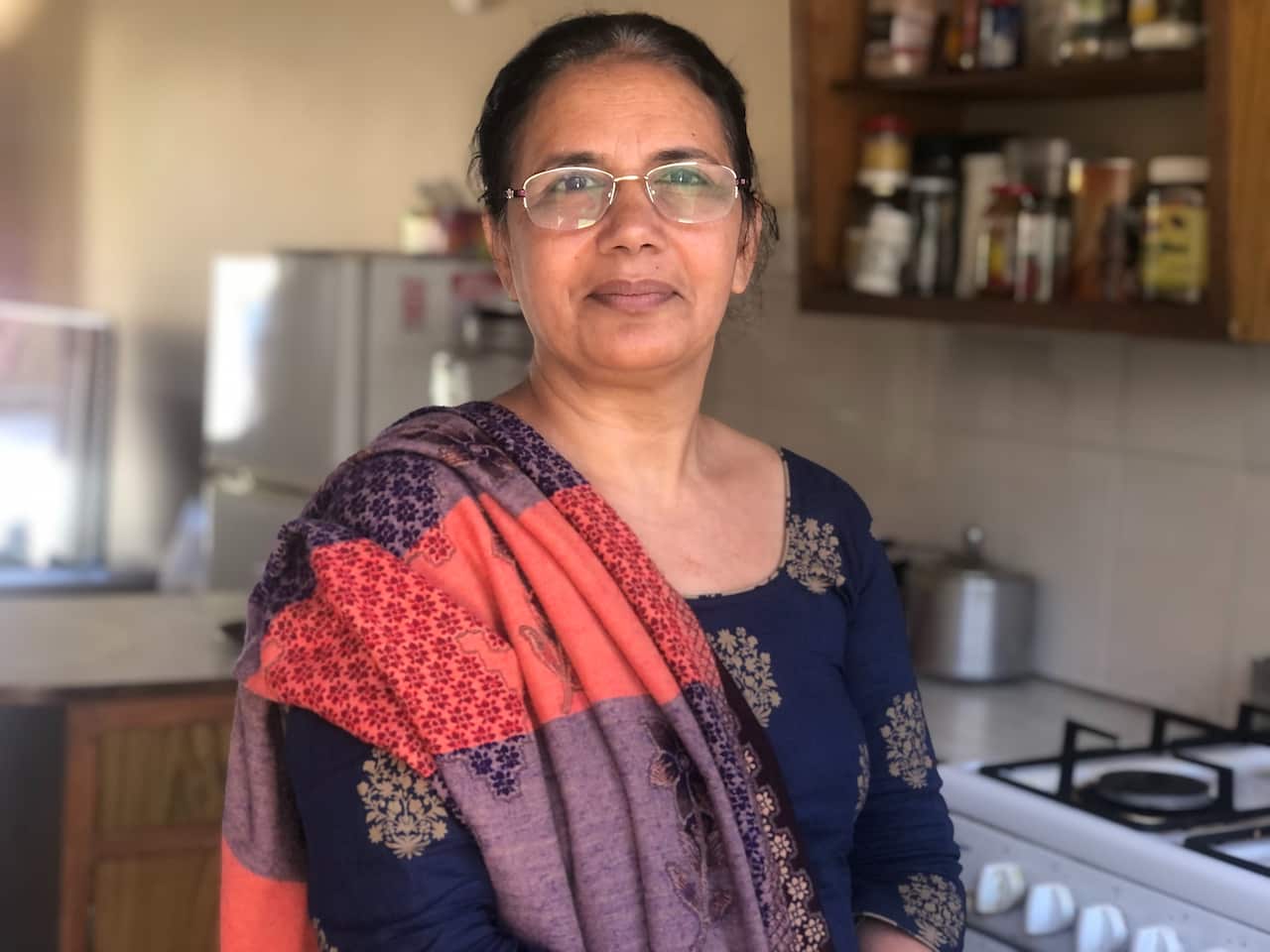 A woman in her kitchen