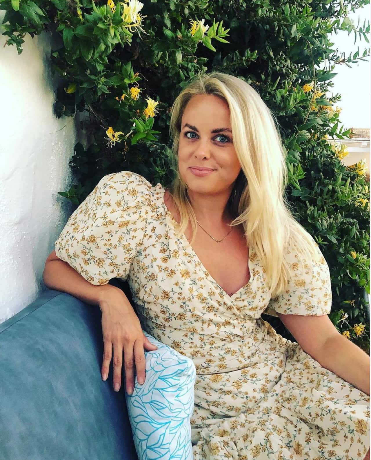 Cecilie Fjellhoy sitting on a couch