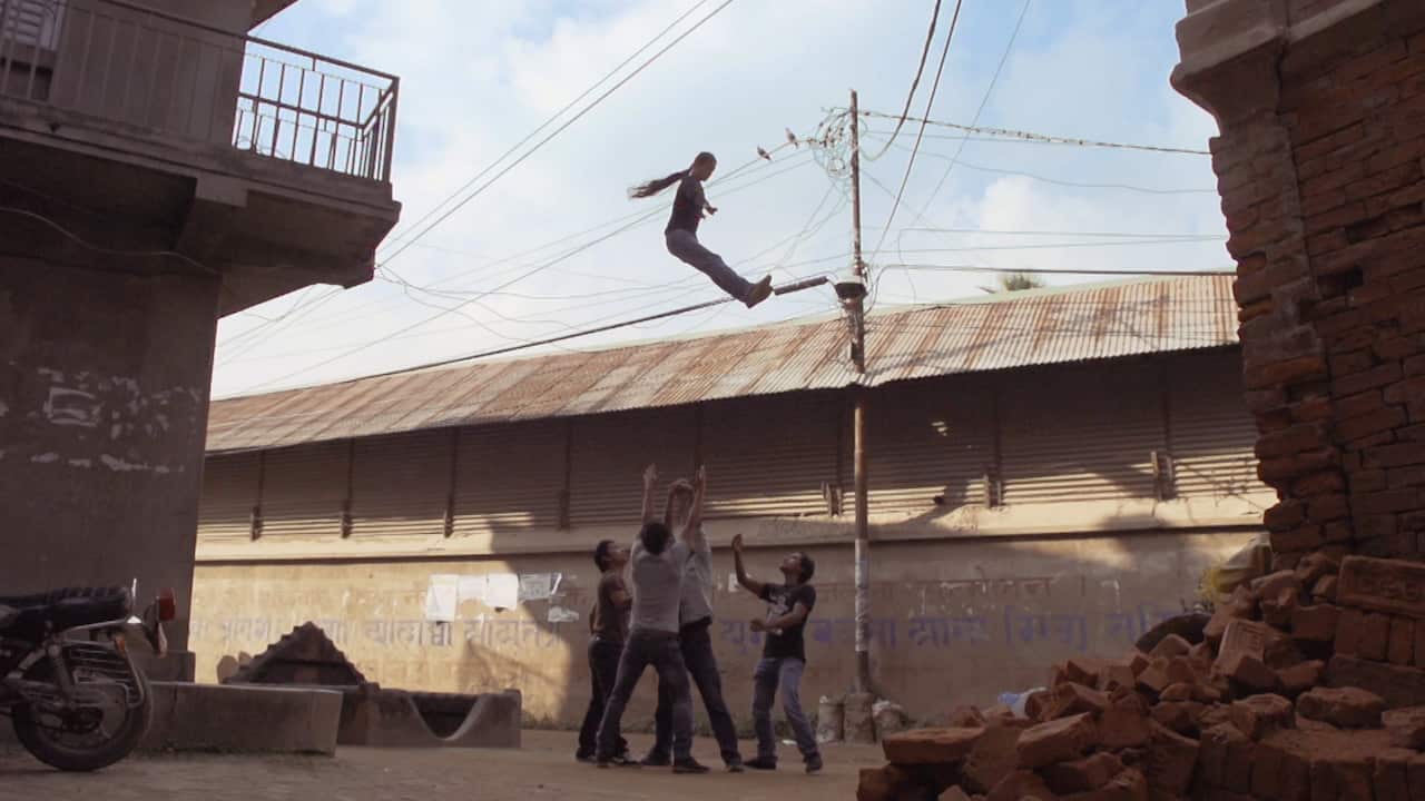A group of performers carry out a circus stunt.