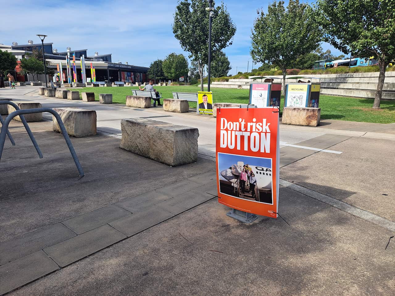 A sign saying 'Don't risk Dutton' remains attached to a metal structure.