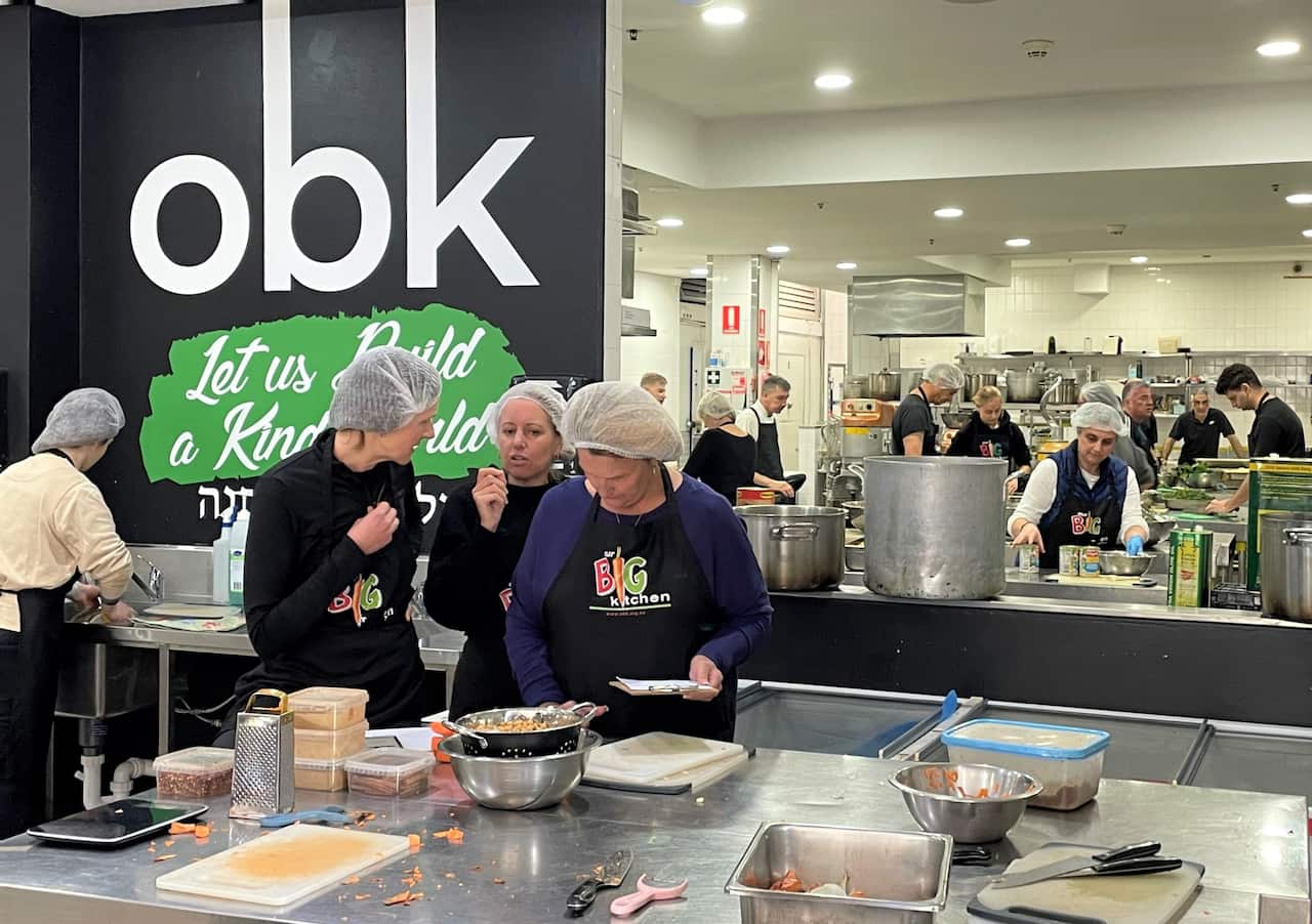 Food preparation is underway at a large commercial kitchen