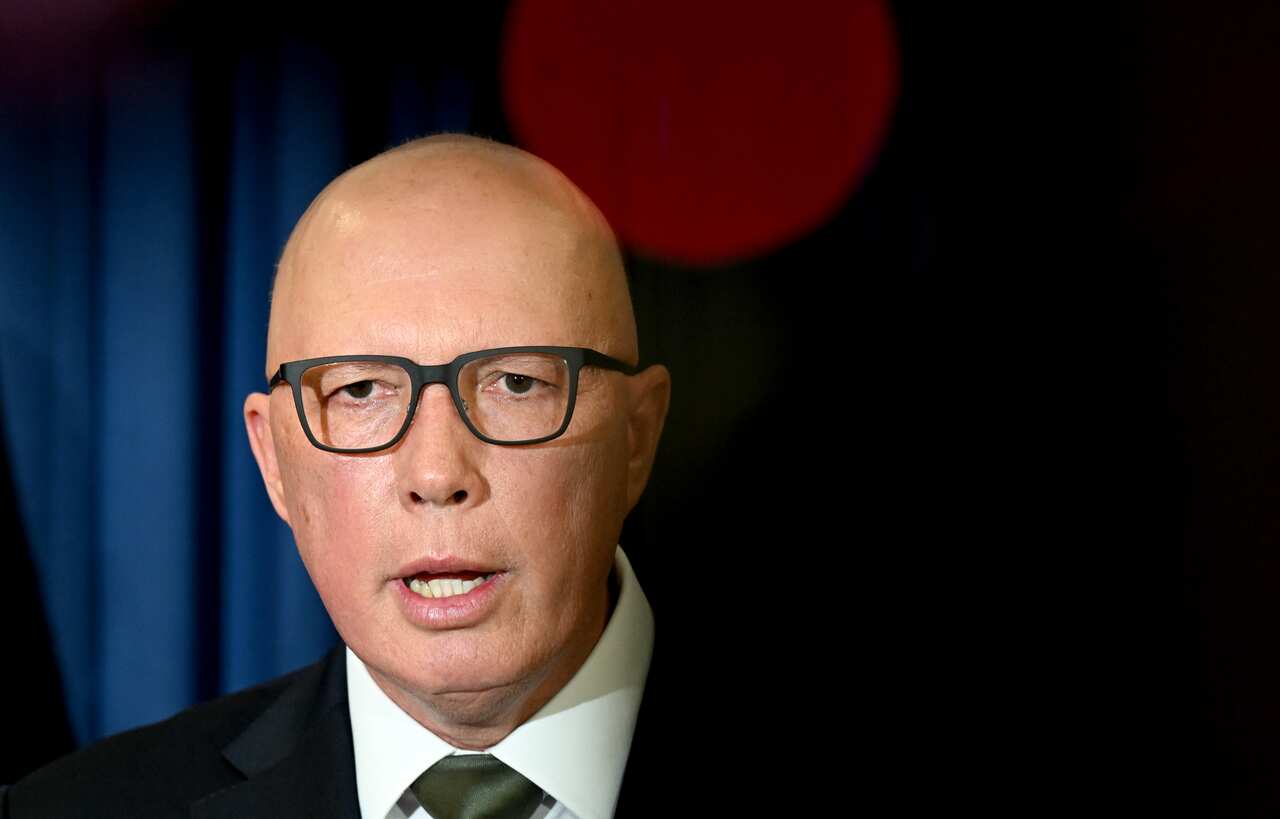 Man in glasses and suit.