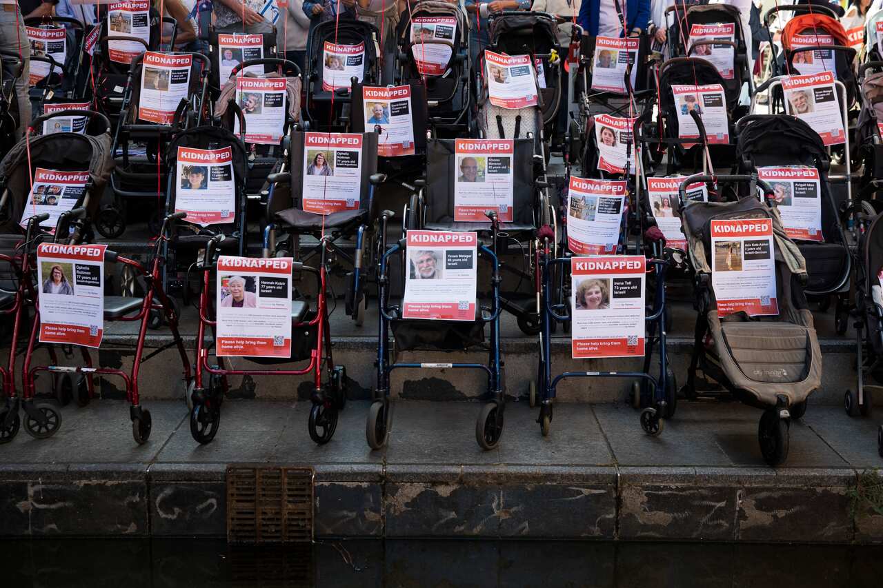 Empty prams with posters in support of hostages