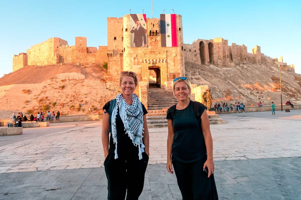 Two women stand for a photo in Aleppo, Syria. 