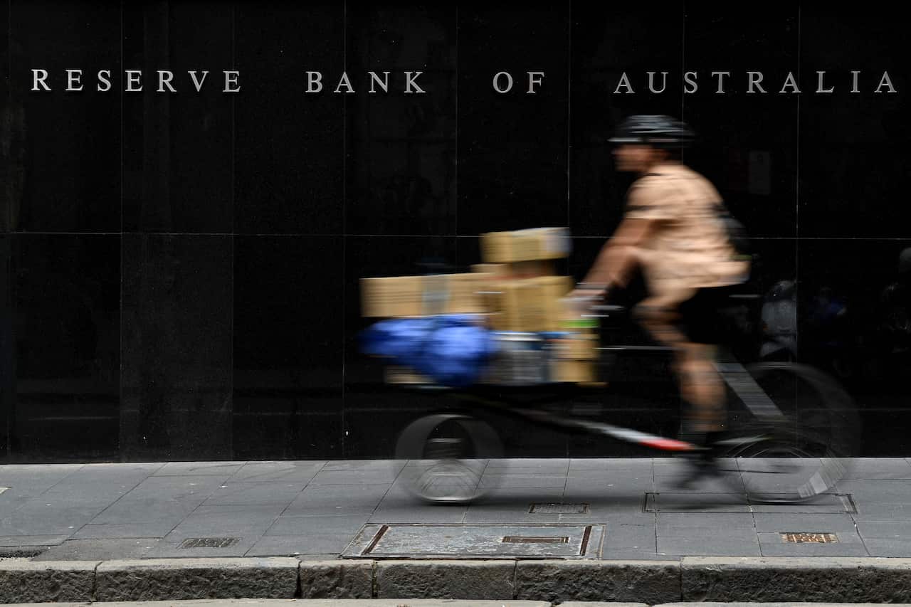A bike moving past the Reserve Bank of Australia building.