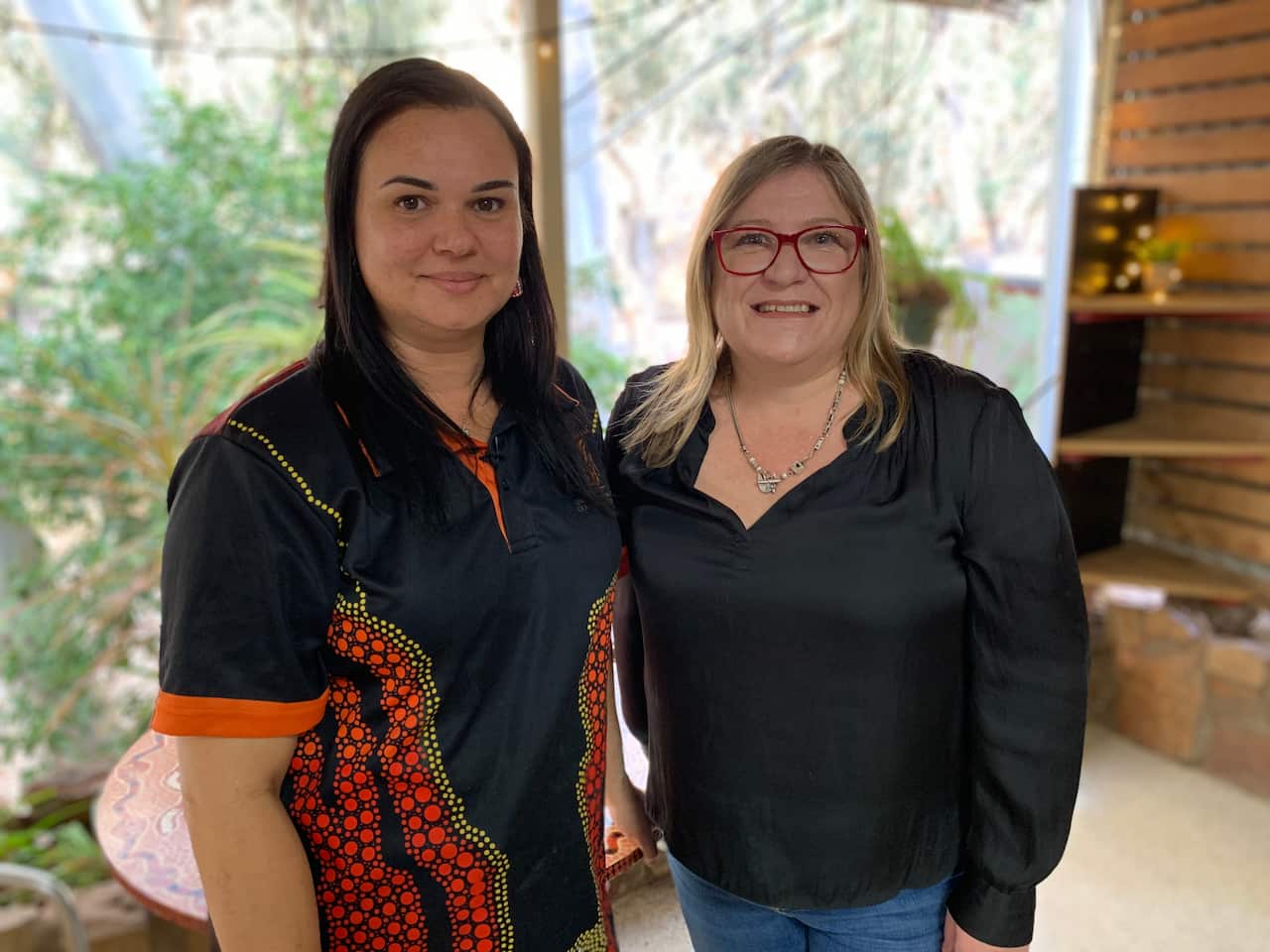 Nova Pomare stands with IBA's Rachel Harding