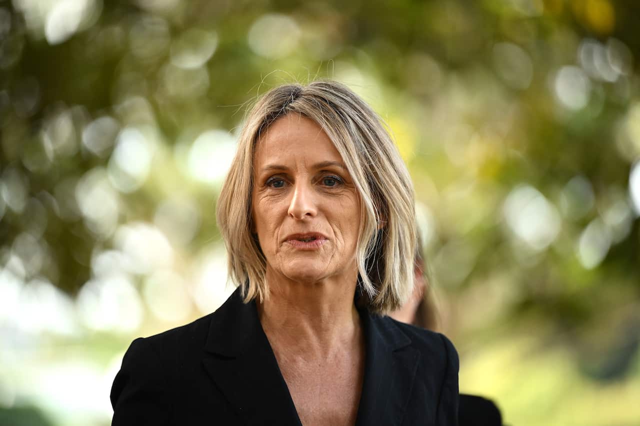 A woman who is speaking outside.