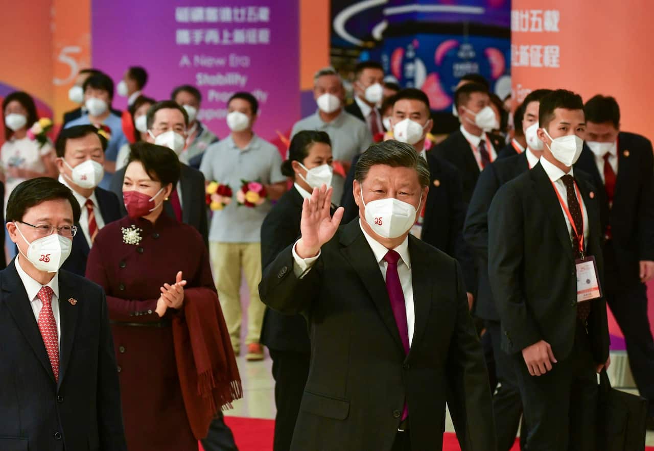 Chinese President Xi Jinping (centre), his wife Peng Liyuan (second from left) and Hong Kong Chief Executive John Lee (left) depart the West Kowloon Station of the Guangzhou-Shenzhen-Hong Kong Express Rail Link in Hong Kong. 