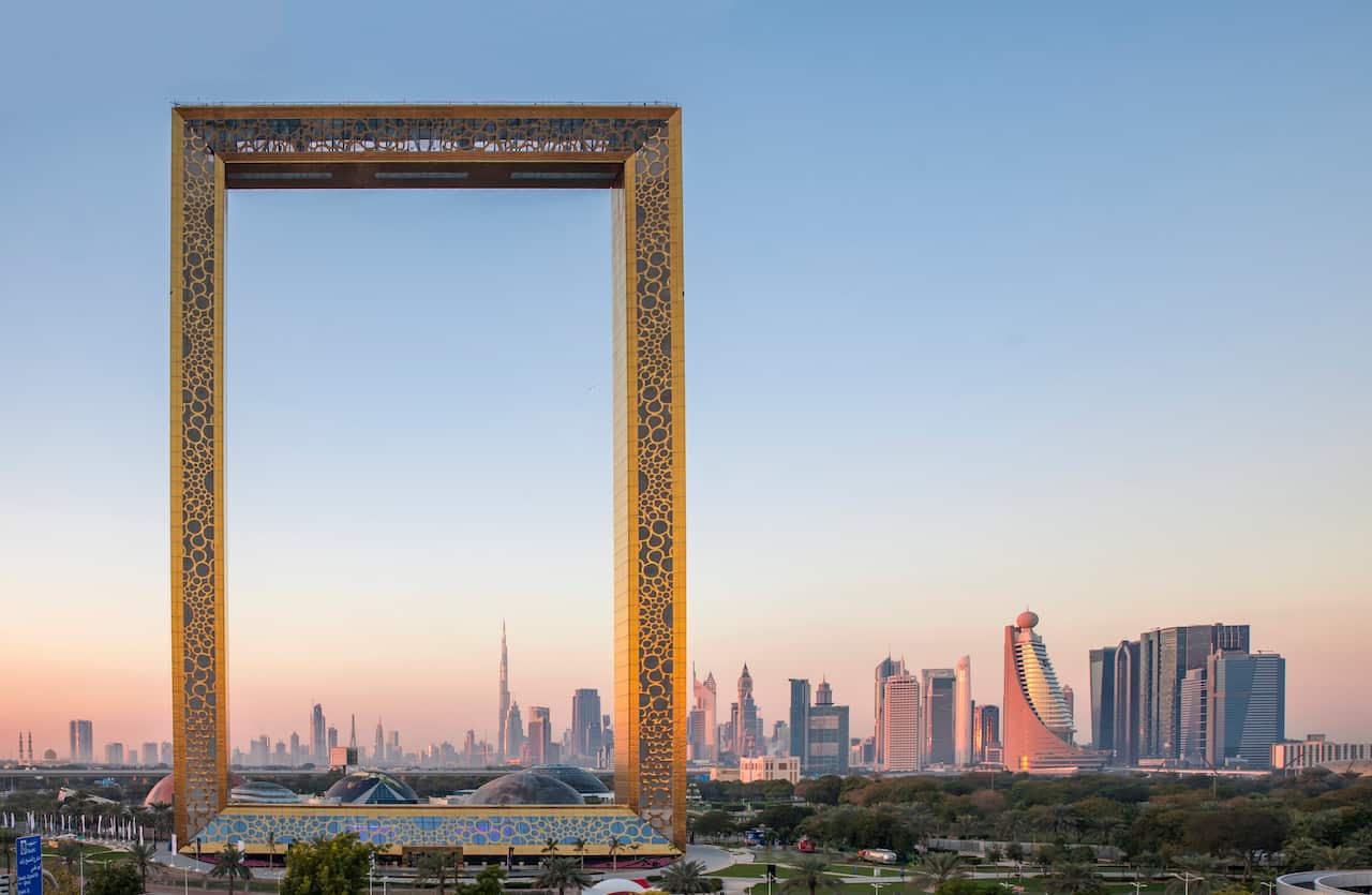 A large building with two narrow towers connected at the top, resembling a giant picture frame.