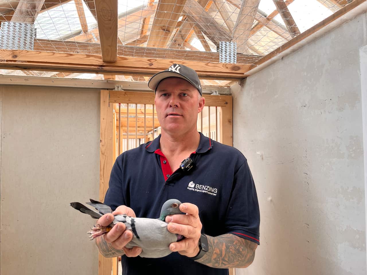 A man holding a pigeon.