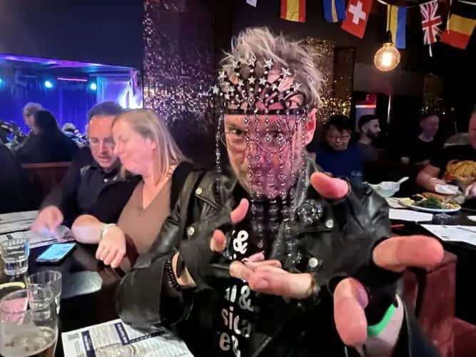 A man wearing a decorative face mask 