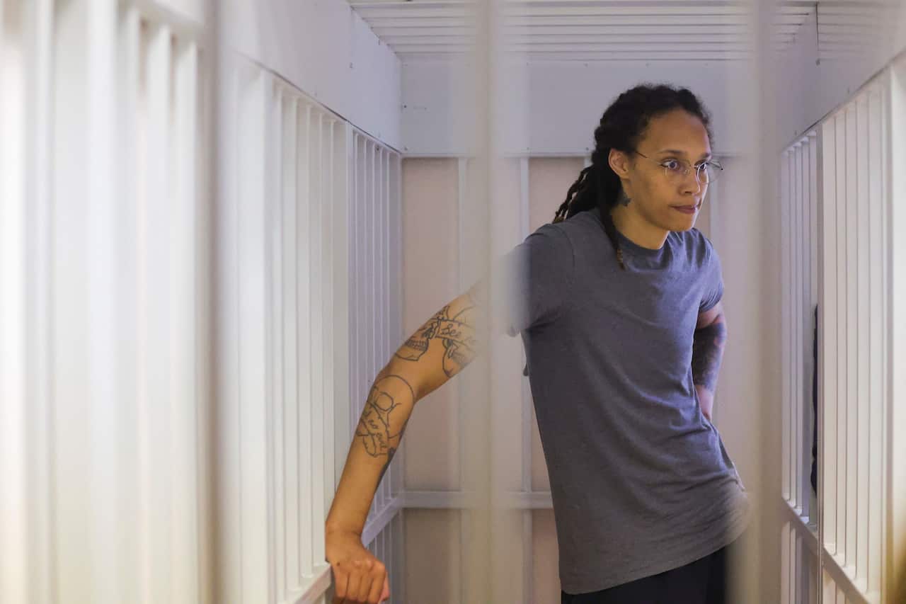 Brittney Griner inside a defendants' cage at a court in Russia.