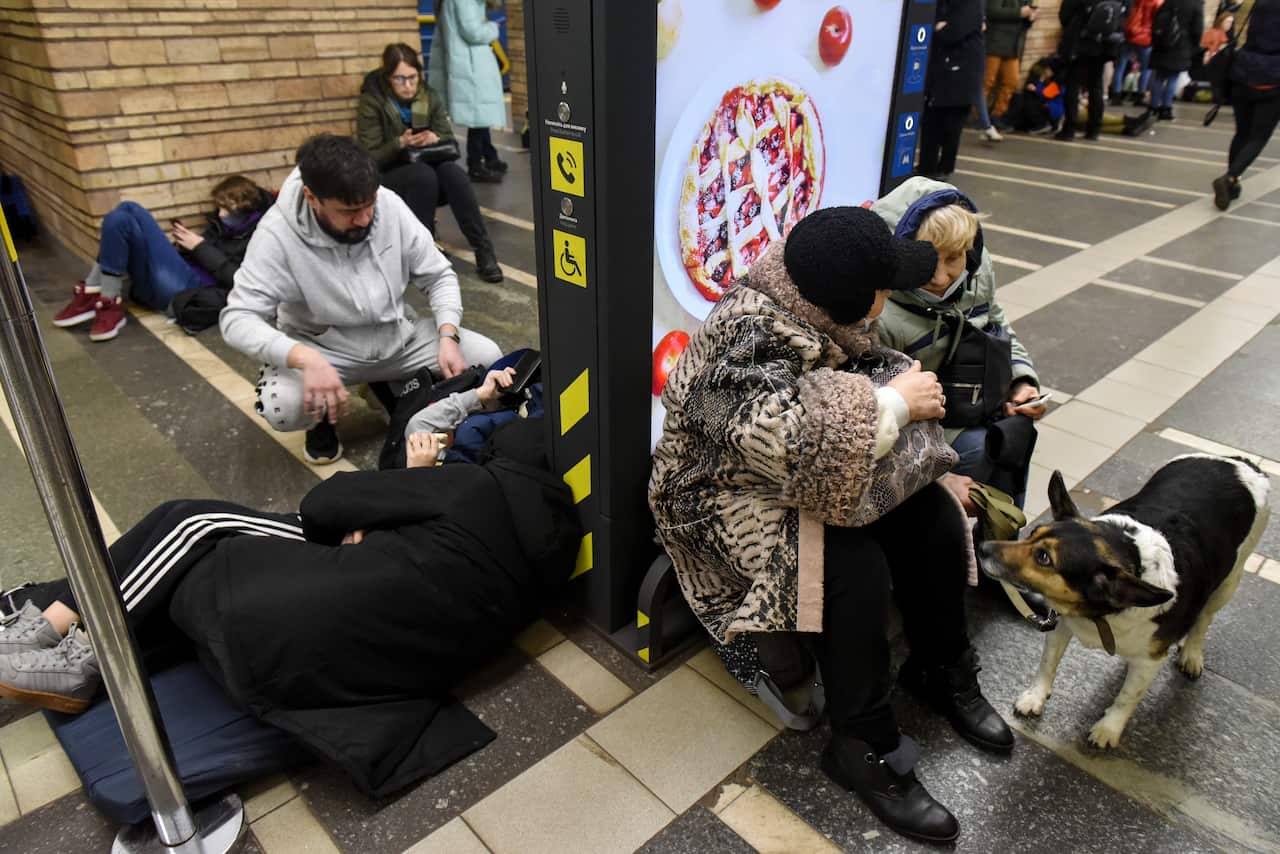 Ukrainians take shelter in a metro station after air raid sirens alarm in Kyiv