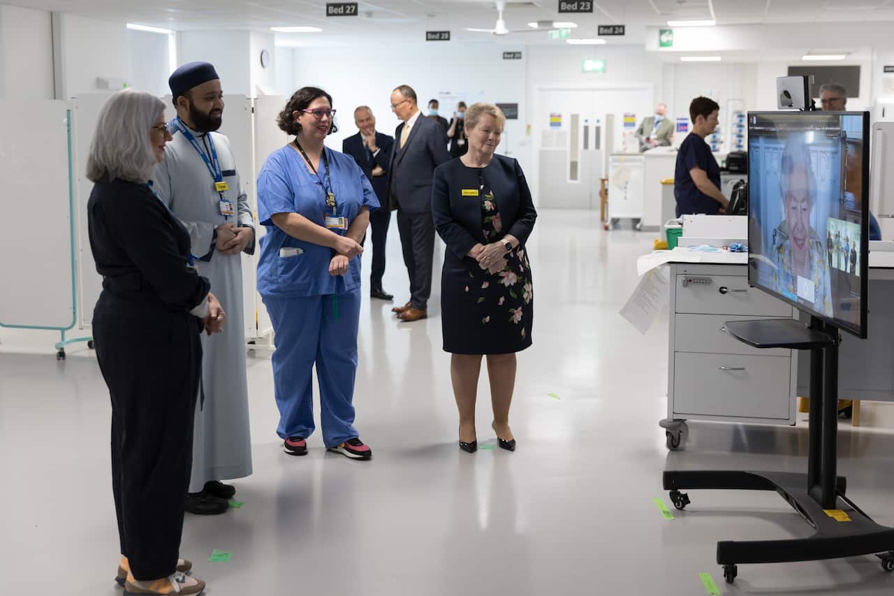 Queen Elizabeth II speaks to hospital staff during a video link call and virtual visit to the Royal London Hospital