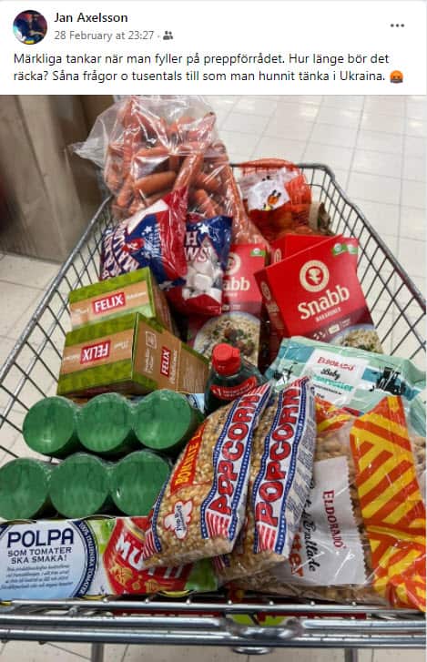 Jan Axelsson's shopping trolley contains food items as part of preparations in the event of war.