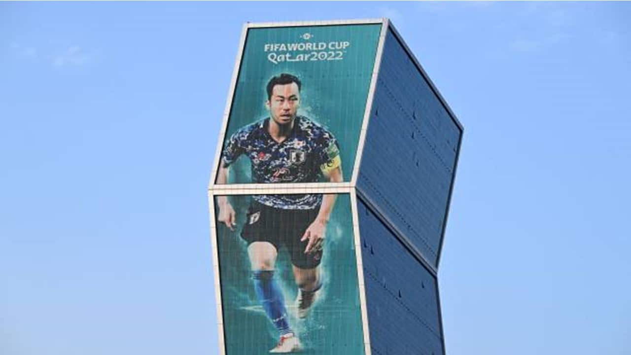 A large picture of Japan's captain Maya Yoshida is displayed on a building in Doha.jpg