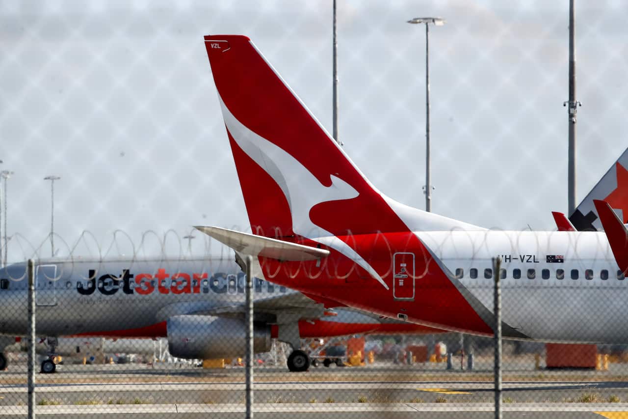 Qantas and Jetstar planes on a runway