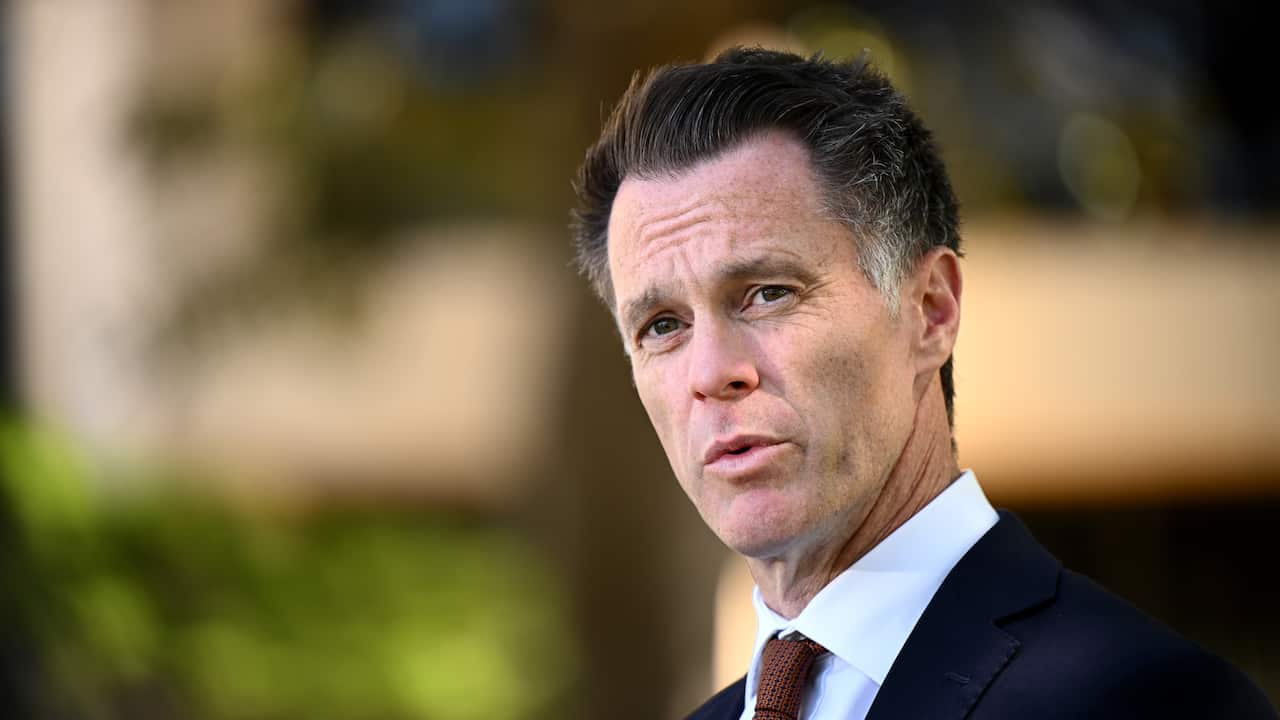 A man in a suit speaking.