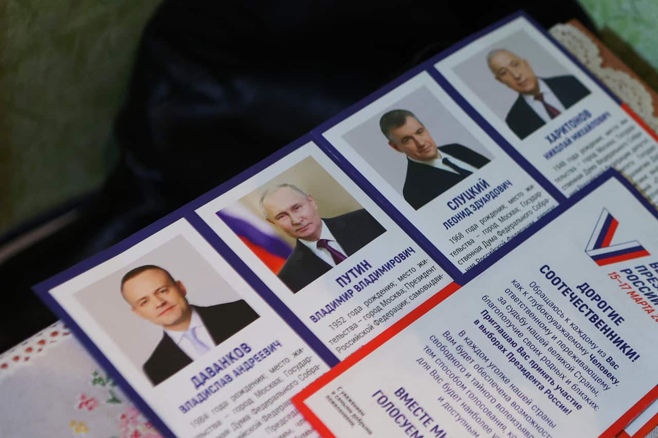 A leaflet displaying presidential candidates on a table.
