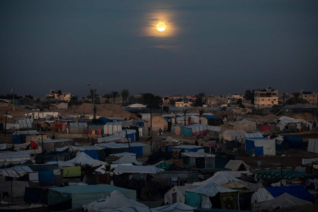 Destroyed buildings, displaced people tents in Khan Yunis, southern Gaza