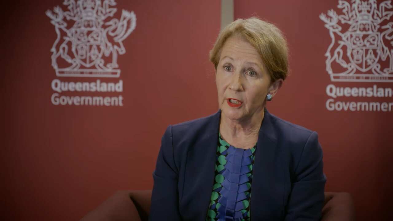 A woman in a blazer doing an interview.