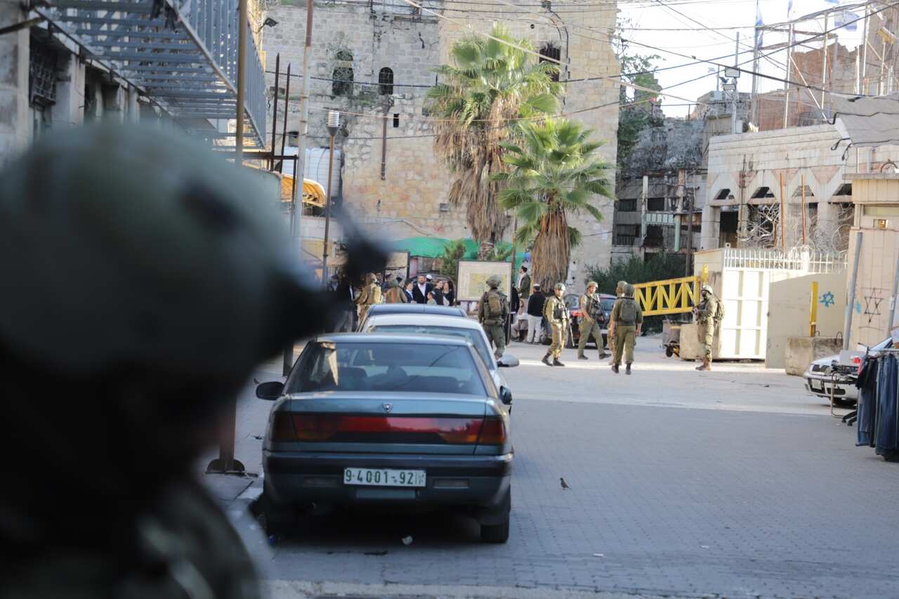 Israeli soldiers gathered in the city of Hebron, West Bank