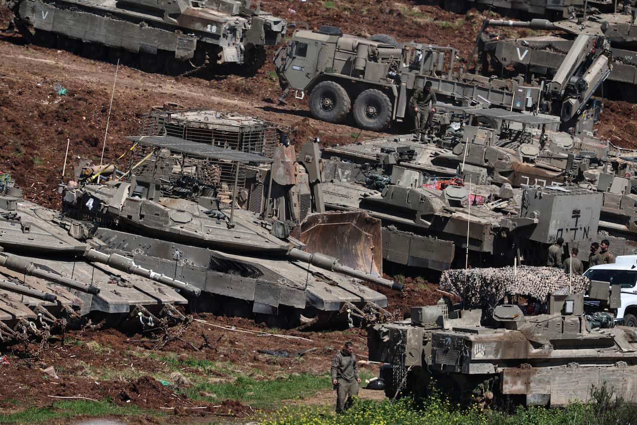 Israeli tanks deployed at military outpost along Lebanon border