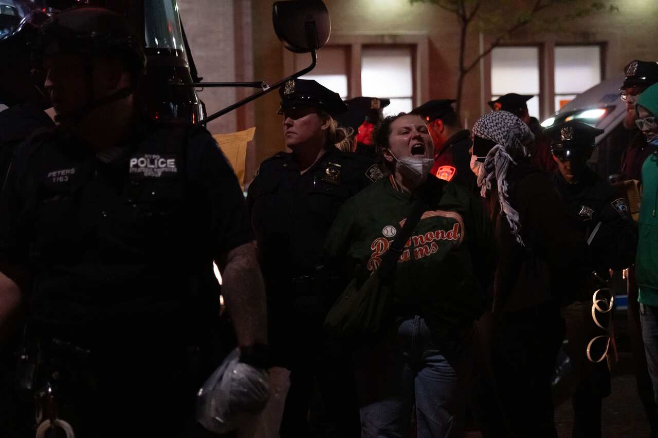 A woman being arrested after a protest