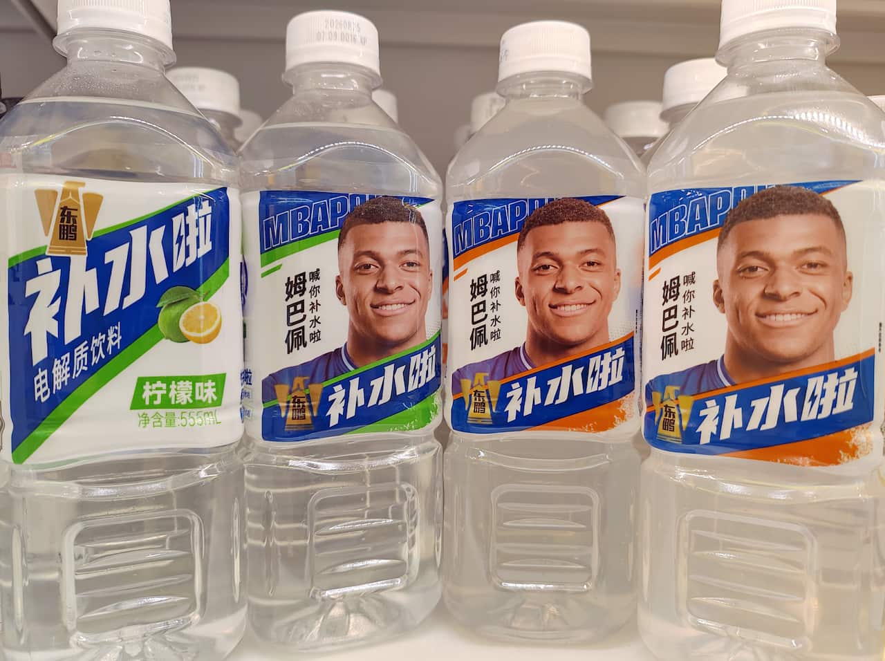 A plastic bottle with a label featuring a portrait of a man