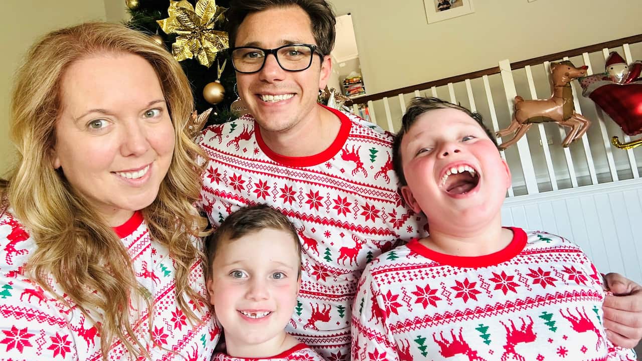 Family wearing Christmas pyjamas