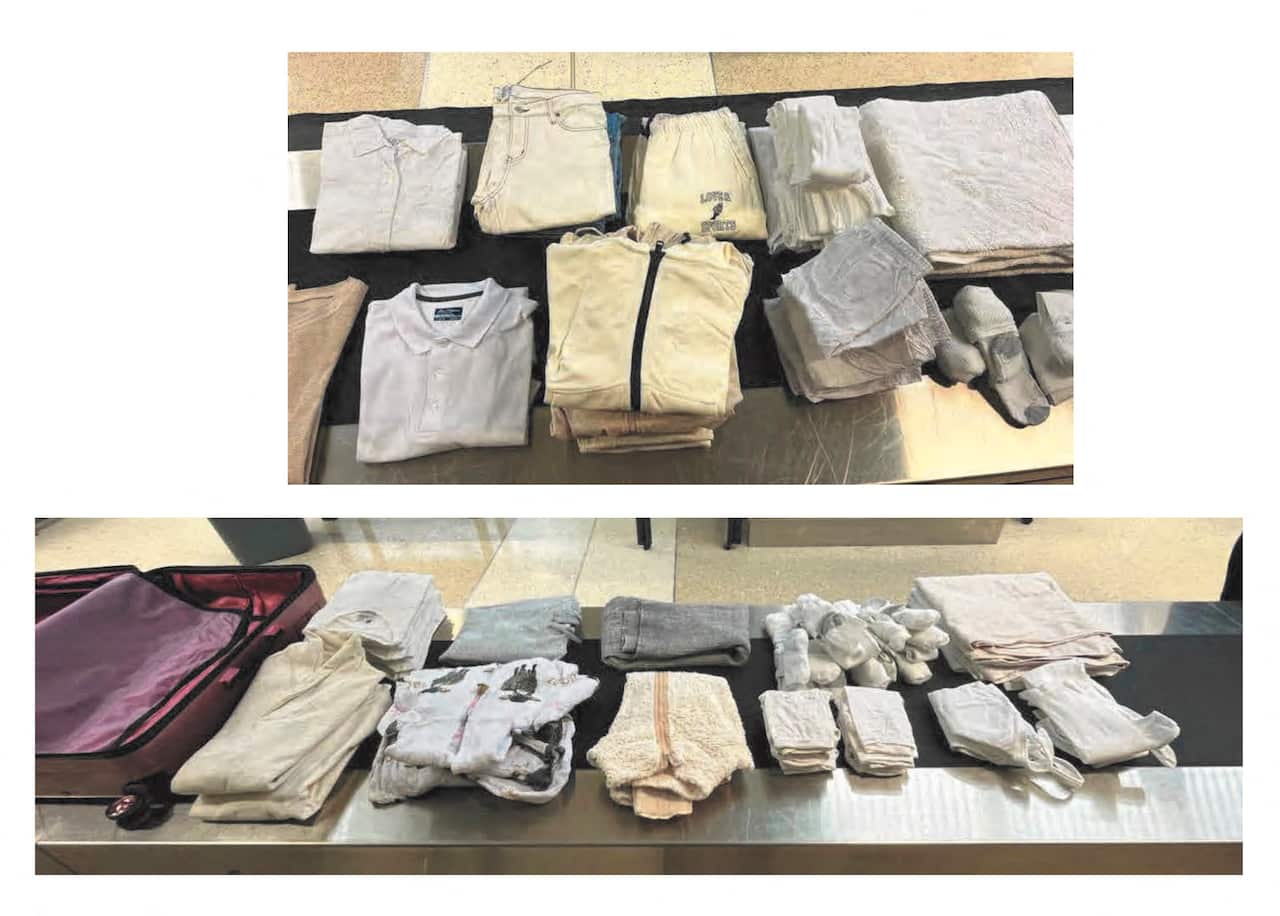 Clothes on a conveyor belt of an X-ray machine at an airport.