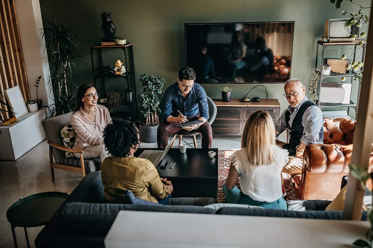 Group of coworkers having morning meeting in the office