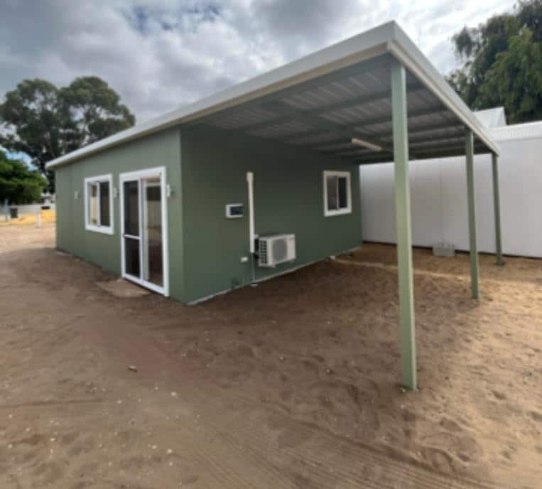 A small home fully built but without any landscaping done.