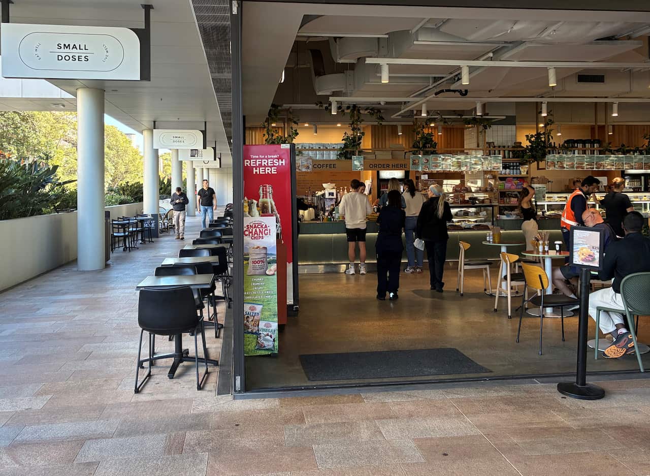People standing inside a cafe.