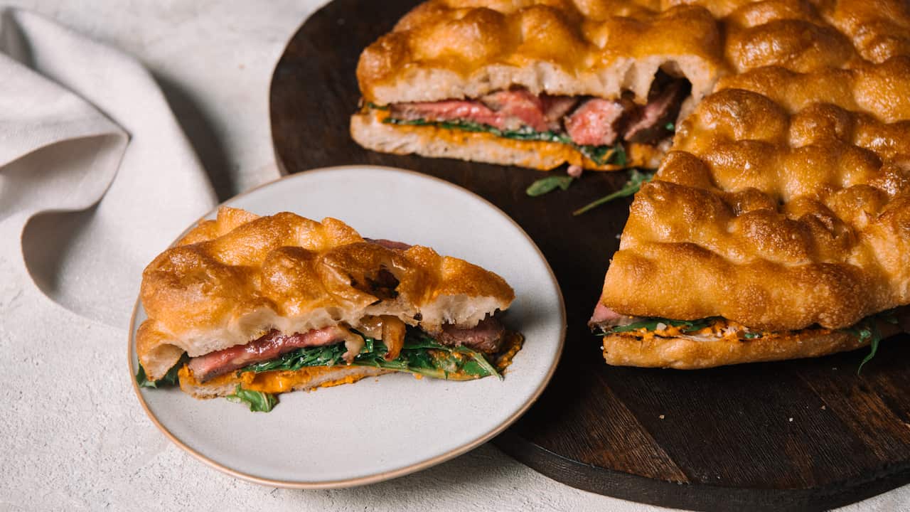 Steak sandwich with quick romesco and rocket