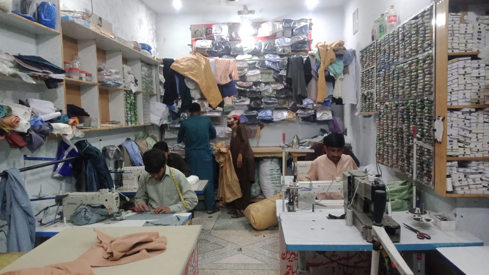 Tailor makes free dresses for orphans.jfif