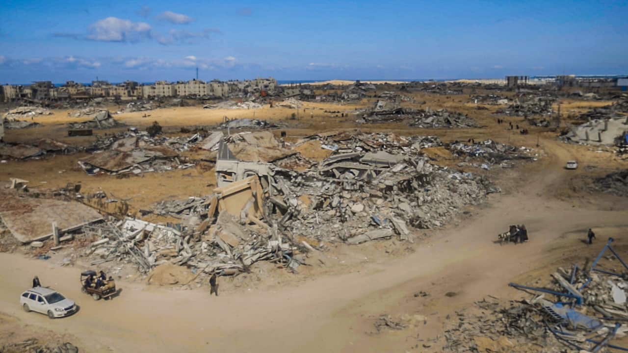 An aerial view showing rubble of buildings.
