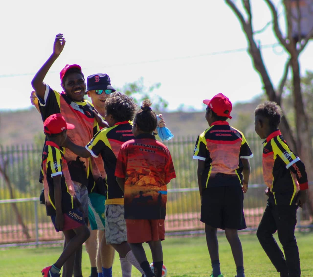 Vision impaired child celebrates a goal