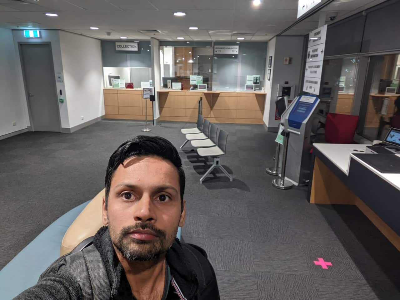  A man taking his selfie in a passport office in Sydney.