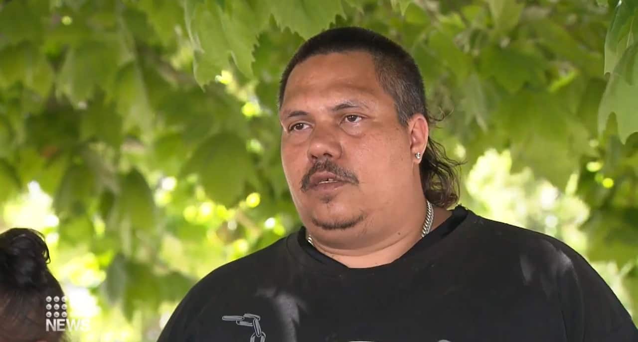 malcolm clifton speaking outside under a tree