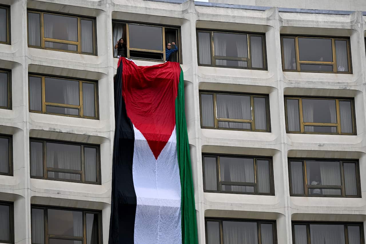 The Palestinian flag hanging out a hotel window