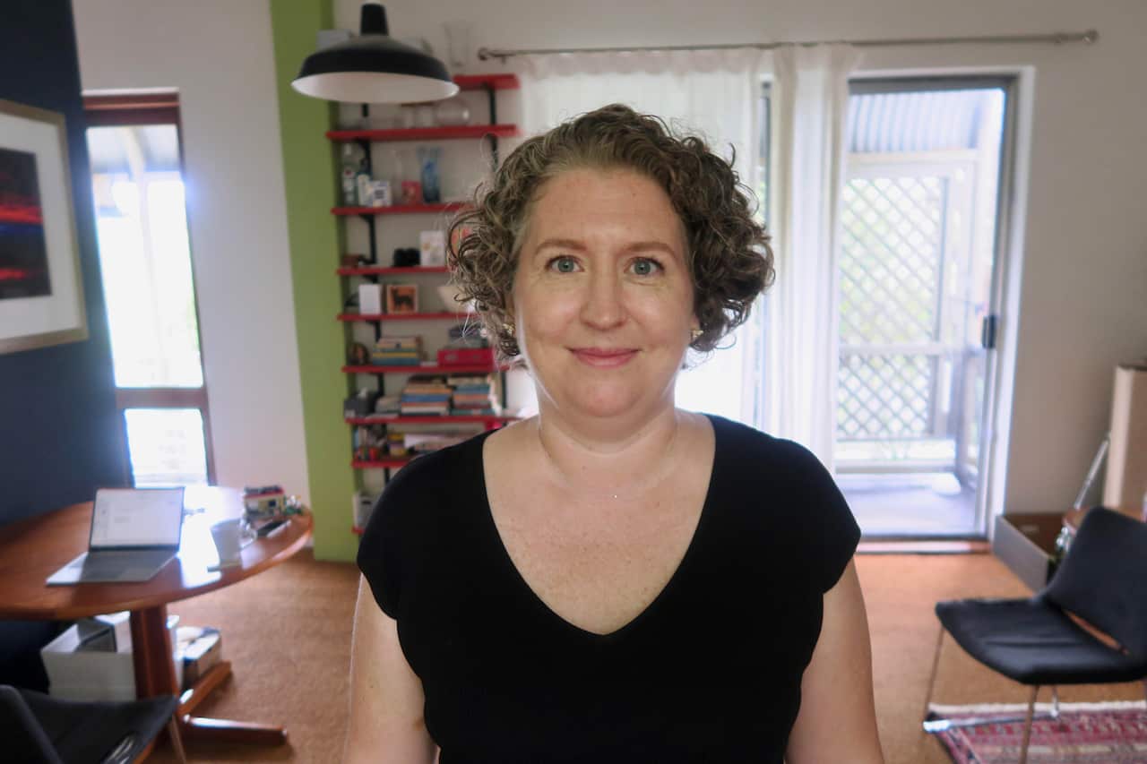 woman standing looking into camera