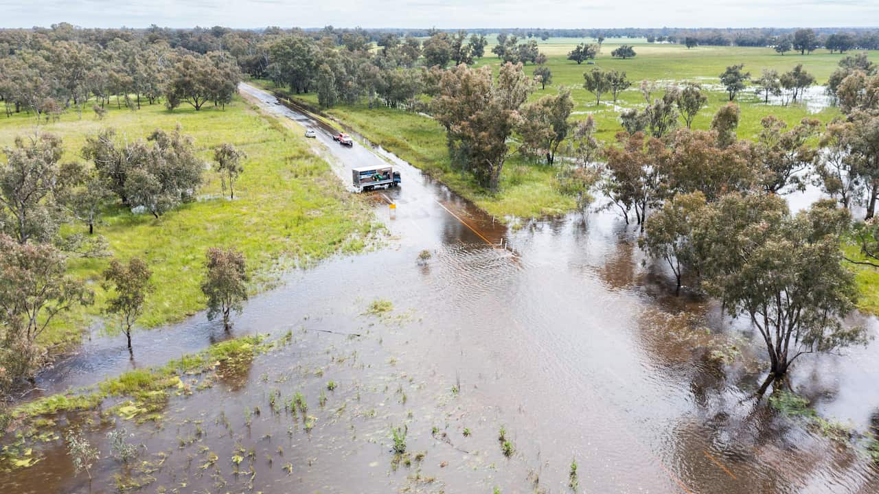 Overhead shot of flooding on road and fields. 