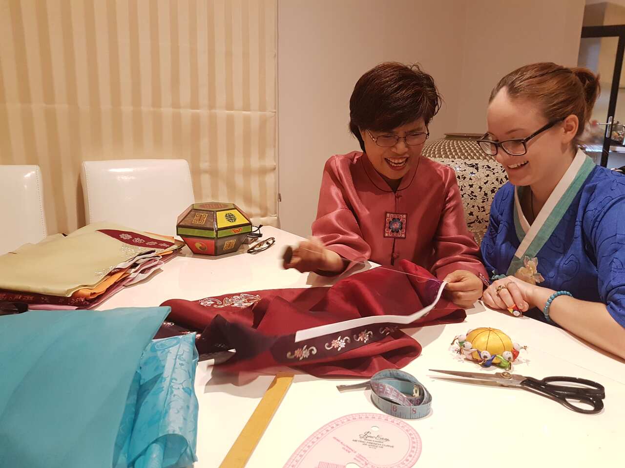 Two women at a sewing table