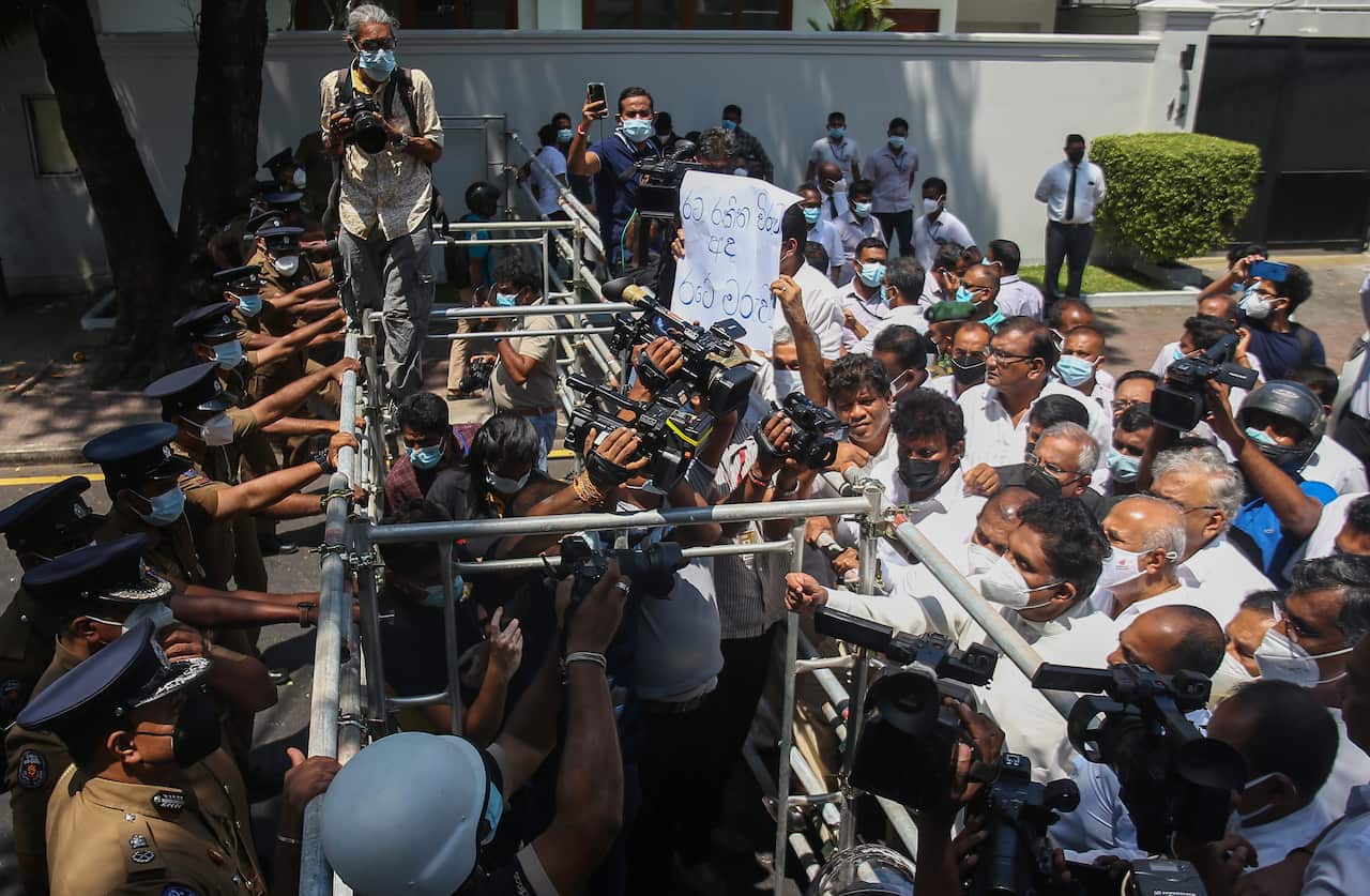 Protesters are seen marching in Colombo, the capital of Sri Lanka.