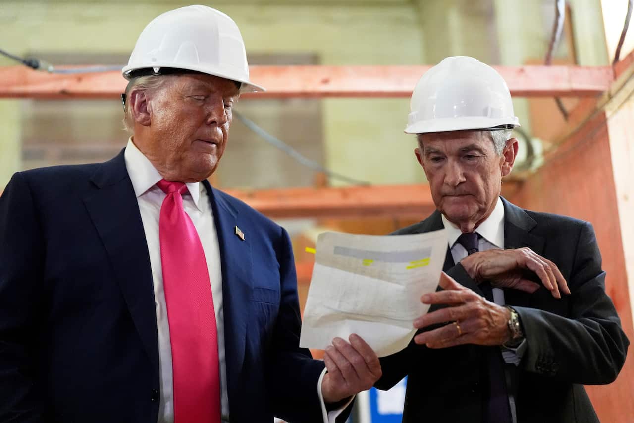 A man handing a piece of paper to another man.