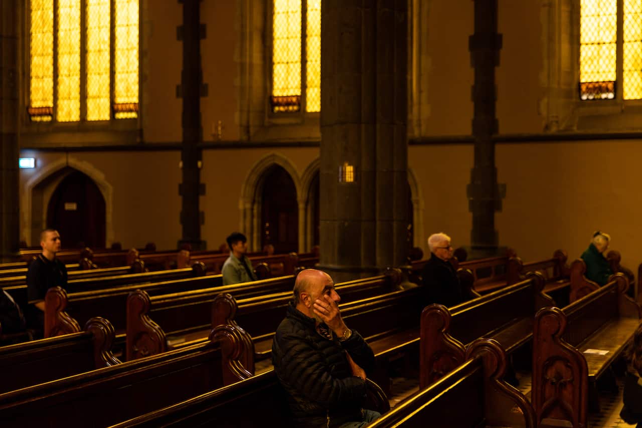 People sitting in pews in a church