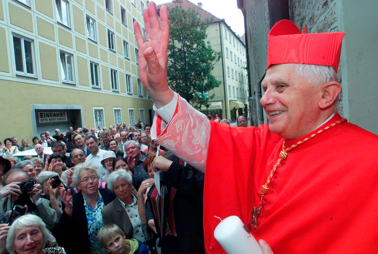 Pope Benedict waves to a crowd